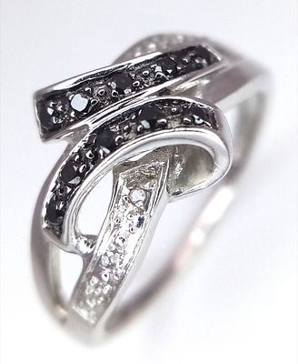 A 9K Yellow Gold Sapphire and Diamond Crossover Ring. Size J 1/2. 2.4g. Ref: 8.3