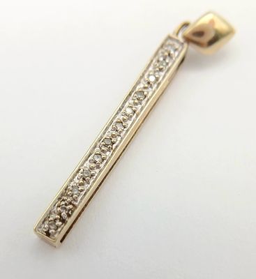 An interesting 9 CARAT GOLD DIAMOND PENDANT with Concealed Slide-Out Ruler reading I LOVE YOU. 