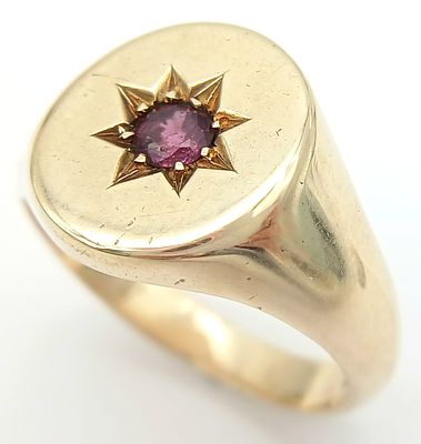 A 9K YELLOW GOLD RUBY SET SIGNET RING 10.7G SIZE V. Ref: SC 7037