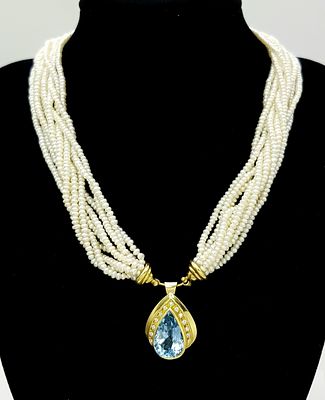 A MULTISTRAND FRESHWATER PEARL NECKLACE WITH 18K YELLOW PENDANT CLASP SET WITH DIAMONDS AND 