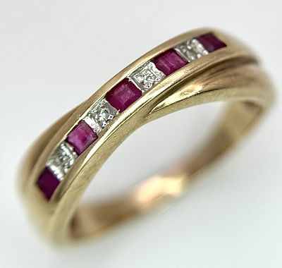 A 9K Yellow Gold Ruby and Diamond Crossover Ring. Size R. 2.83g.