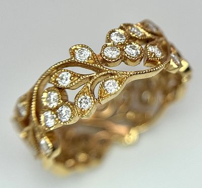 An 18K Yellow Gold, Diamond Band Ring in Openwork Floral Form. Size K. 3.2g. MT13.
