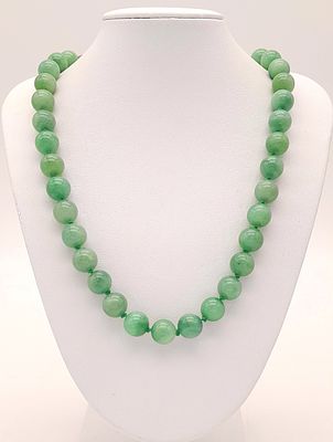 A Vintage Screw Clasp Jade Bead Necklace-60cm Length. Strung with Fifty 9mm Jade Beads. Knotted 