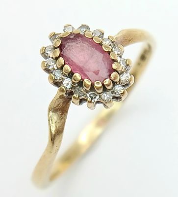 A 9K Yellow Gold Ruby and Diamond Surround Ring. Size K. 1.3g.