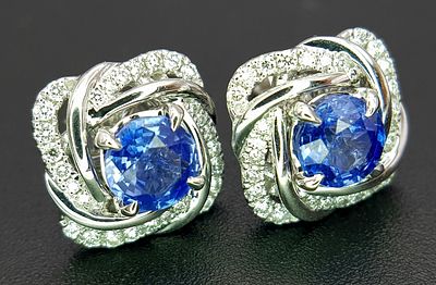 A Pair of 18K White Gold, Blue Tanzanite and Diamond Stud Earrings. 4.47g total weight. MT38.