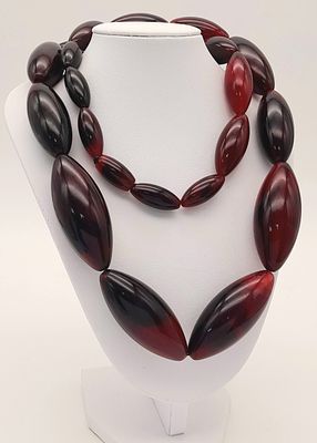 A Rare Vintage Cherry Amber Colour Lucite Necklace- 80cm Length. Gross Weight 155 Grams. Beads 