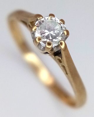 A 9K Yellow Gold White Stone Solitaire Ring. Size K. 1.1g.