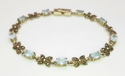 A Pretty Vintage Sterling Silver Blue Topaz and Marcasite Bracelet-19cm Length. Set with Nine 