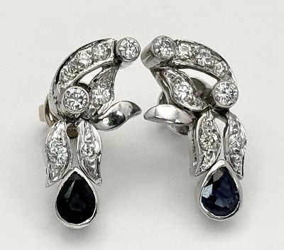 A Pair of 18K Gold Green Sapphire and Diamond Drop Earrings. Butterfly backs - one 18K white 