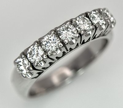 An 18K White Gold Diamond Seven Stone Ring. 0.70ctw of round brilliant cut diamonds. SI1/2 