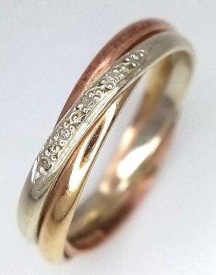 A 9K Rose and White Gold Diamond Crossover Ring. Size N 1/2. 3.2g.