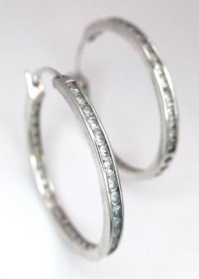 A stunning pair of 925 silver CZ fashion hoop earrings. Total weight 5.3G.