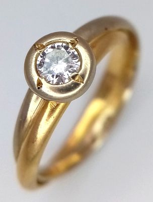 An 18K Yellow and White Gold Diamond Solitaire Crossover Ring. Size J. 3.2g. Ref: 2.6.