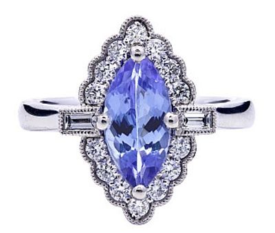 A Platinum, natural Tanzanite and Diamond Ring. Marquise shape. Tanzanite - 1.15ct. Diamond - 
