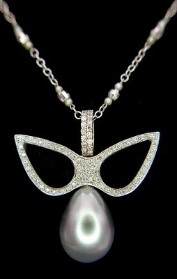 An Angelic 18K Gold, Tahitian Pearl and Black Onyx Pendant on an 18K White Gold Fancy Chain. 