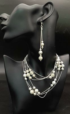 An Italian Sterling Silver Set of Necklace, Bracelet and Pair of Drop Earrings. Bauble 