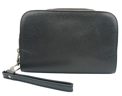 A Louis Vuitton Taiga Baikal Leather Clutch Bag. Black leather exterior with silver-tone 