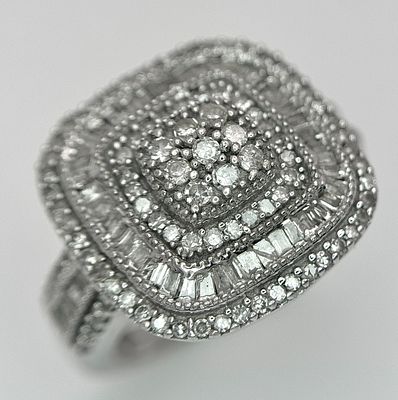 A Vintage Sterling Silver and Diamond Set Cluster Ring Size M, set with round and baguette cut 