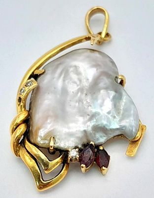 A Beautifully Abstract 18K Yellow Gold and Baroque Pearl Pendant with Ruby and Diamond accents. 