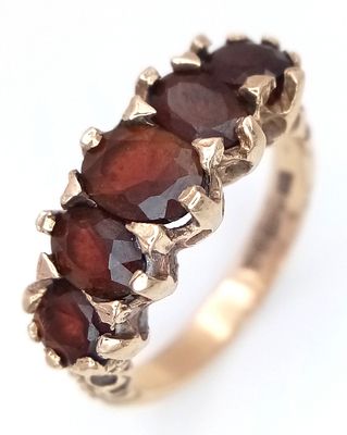 A 9K Yellow Gold Garnet Five Stone Ring. Size M. 4.2g. N26/11606.