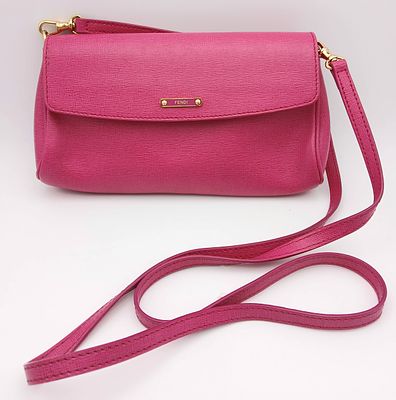 A Fendi Pink Leather Shoulder Bag. Pink leather exterior with gold-tone logo hardware 