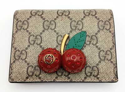 A Gucci GG Supreme Cherry Card Holder Wallet. Ebony GG Supreme canvas exterior with gold-tone 