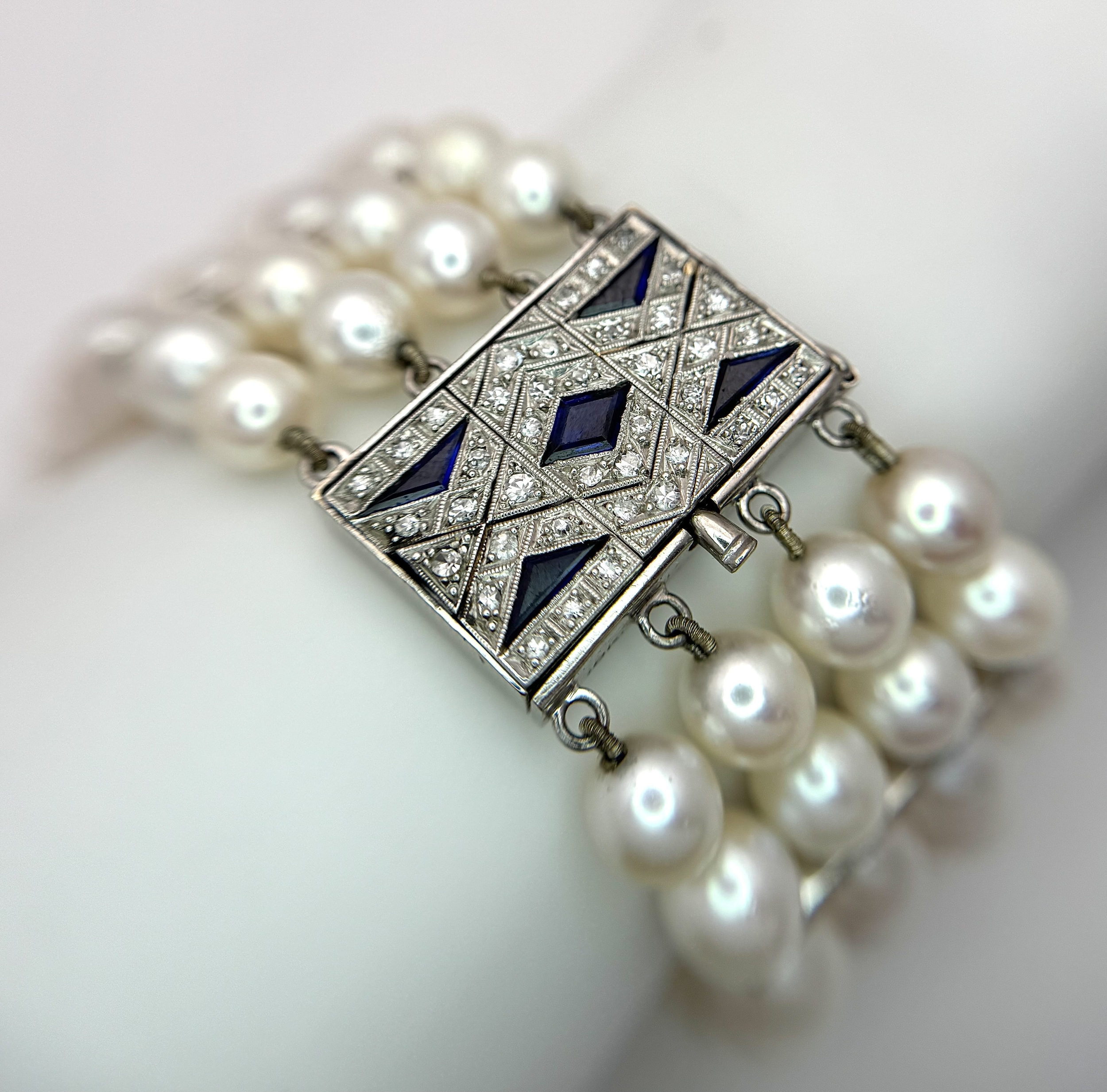 A FOUR ROW, 8MM AKOYA DESIGNER PEARL BRACELET