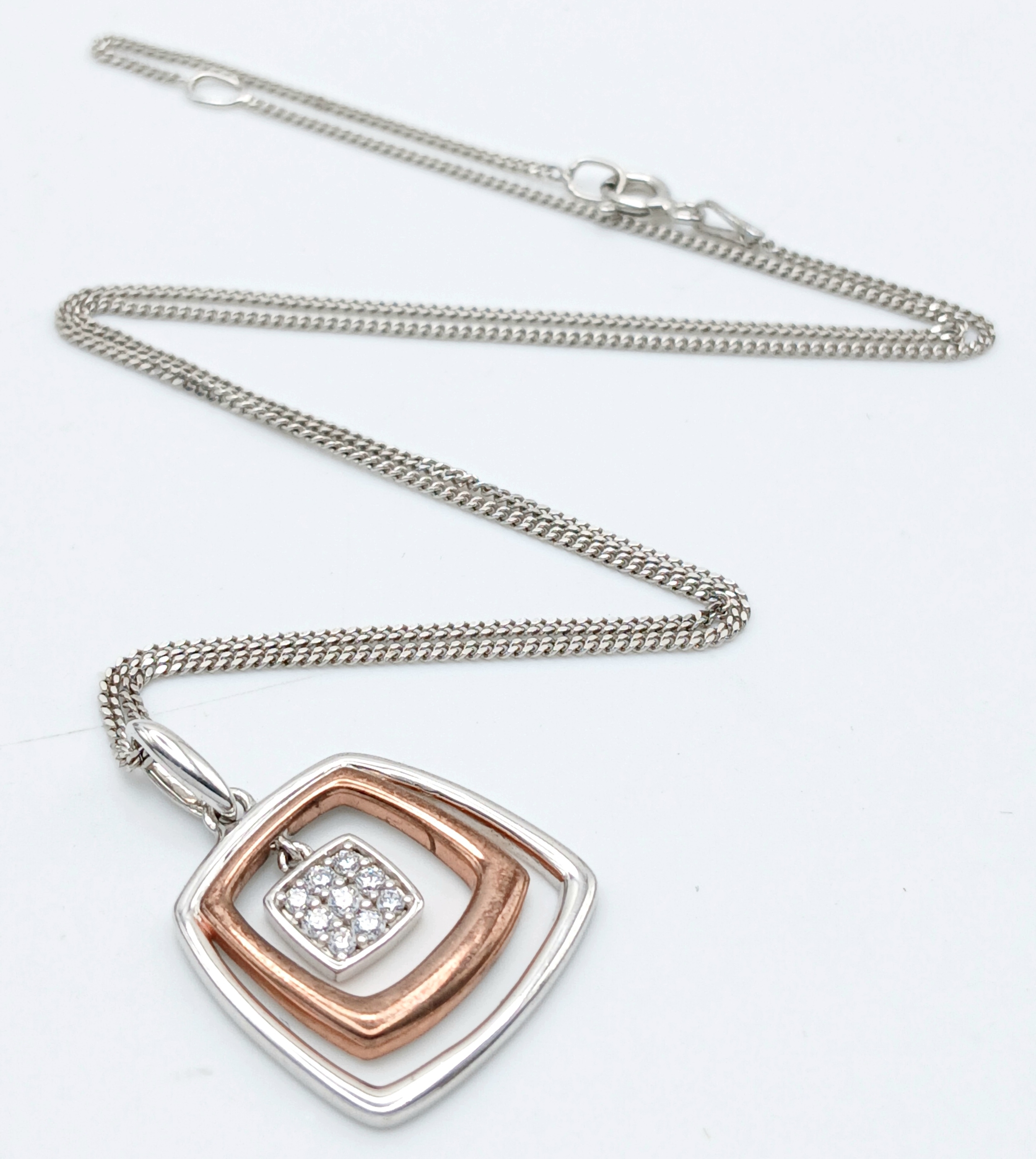 A 925 silver necklace with a rose gold gilded square pendant