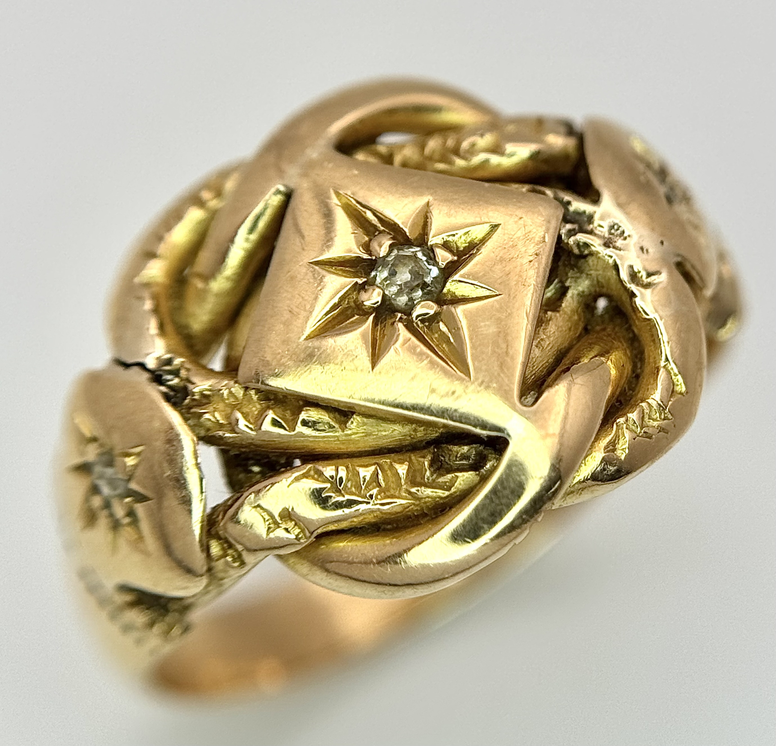 An Antique 18K Yellow Gold and Diamond Lovers Knot Ring