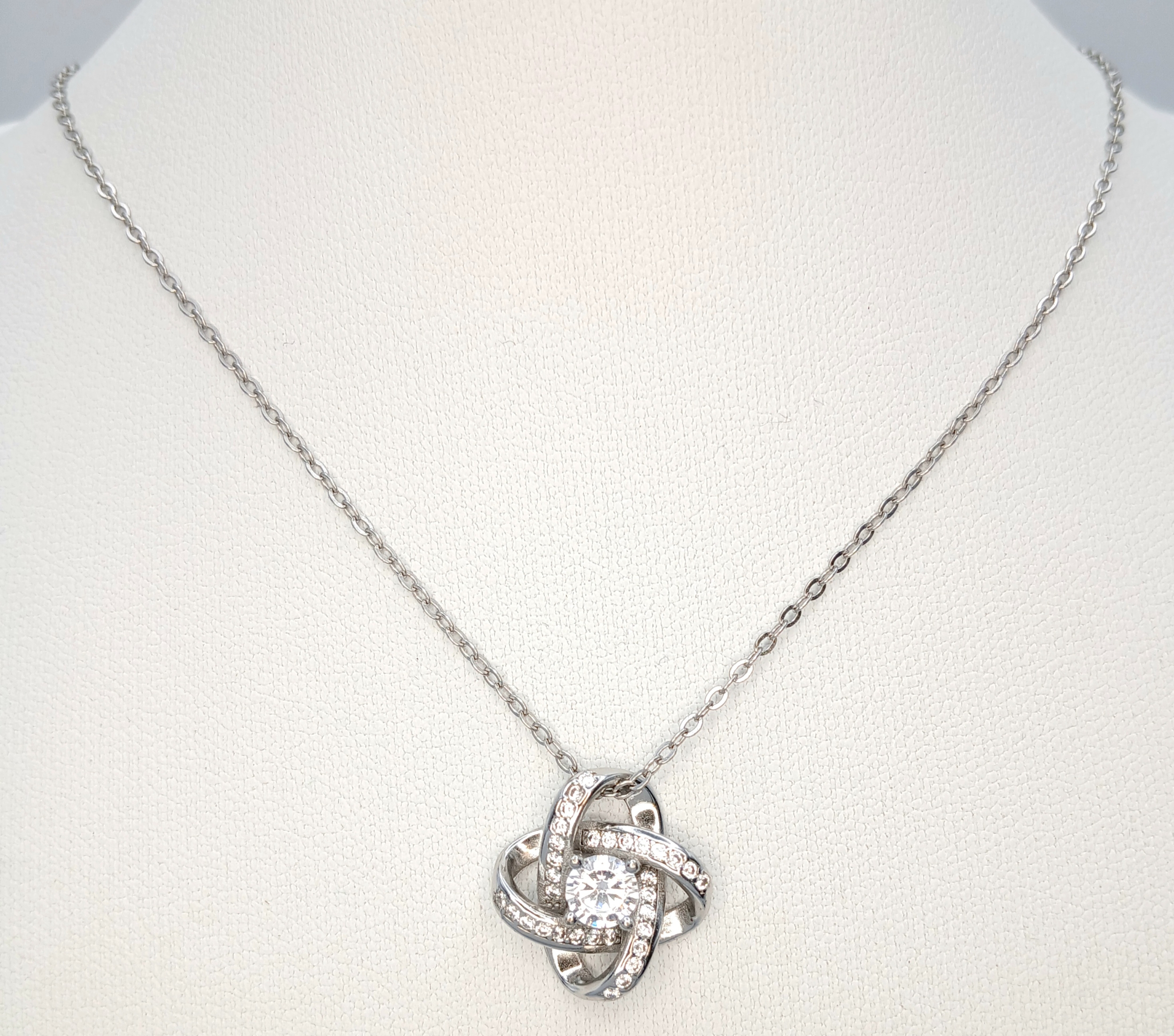 A 925 Sterling Silver Necklace with a stone set Knot Pendant