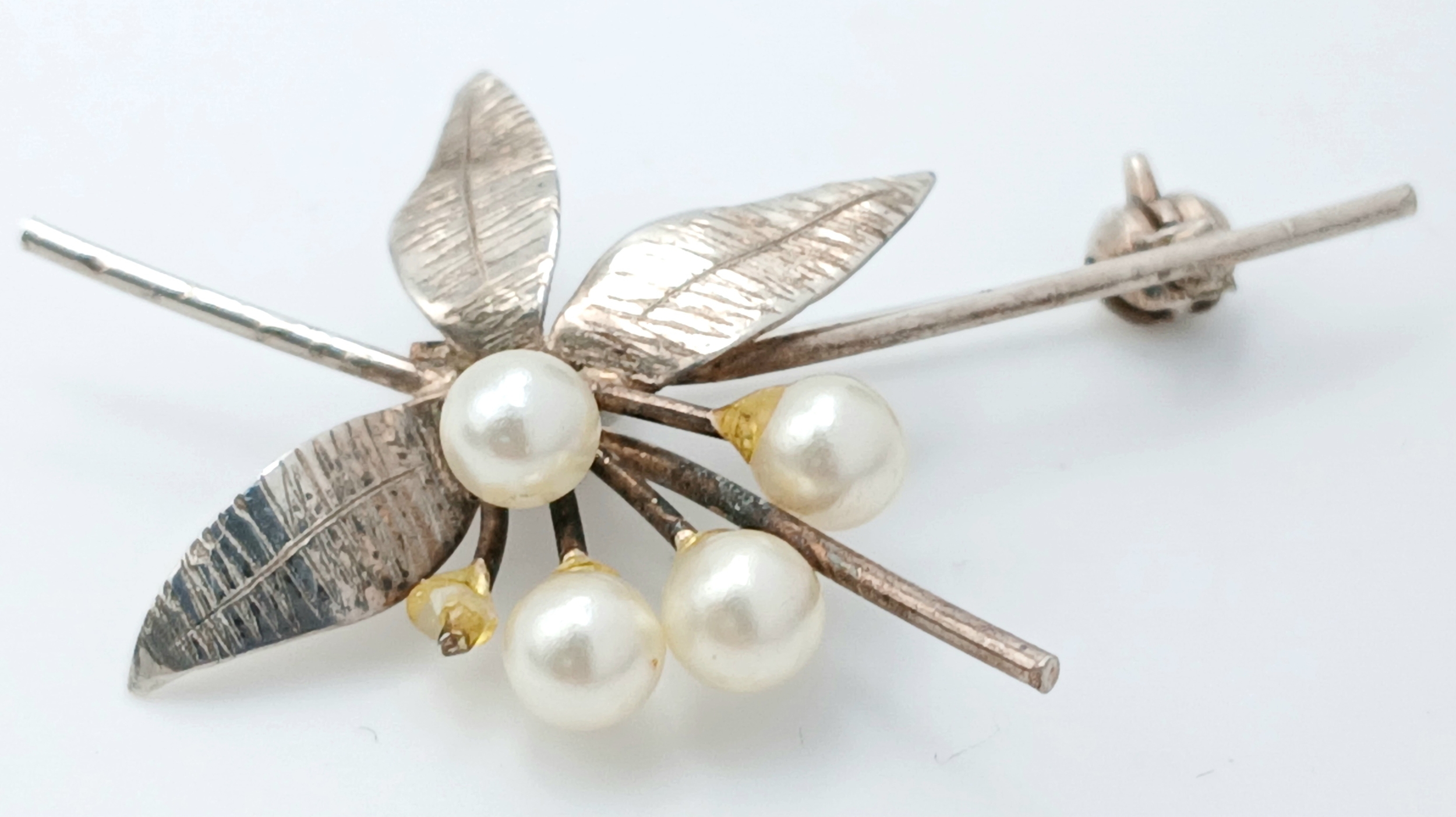 A Silver Leaf Brooch with Faux Pearl Berry Detail
