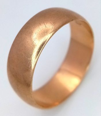 A Vintage 9K Yellow Gold Band Ring. UK hallmarks. 7mm width. Size T 1/2. 5.6g.