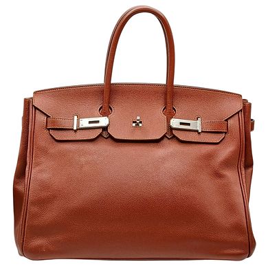 An Herm&egrave;s Brick Red Courchevel Birkin 35 Handbag. Brick red Courchevel leather exterior with 