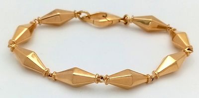 A Cleopatra 18K Yellow Gold Faceted Barrel Link Classic Bracelet. Approx 18.5cm length. Total 