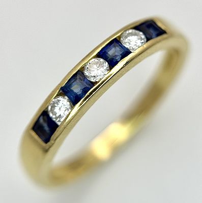 AN 18K YELLOW GOLD, DIAMOND AND SAPPHIRE SET, CHANNEL SET, HALF ETERNITY RING. 3.1G, SIZE N. 