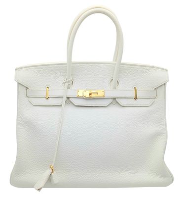 An Herm&egrave;s White Togo Birkin 35 Handbag. White grained calfskin leather exterior with gold-toned 