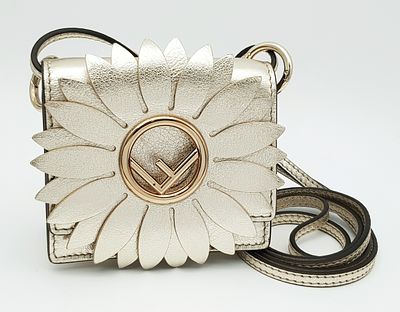 A Fendi Flower Micro Kan I Crossbody Bag. Metallic champagne leather exterior with gold-tone 