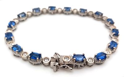 A Beautiful Sterling Silver Blue and White Topaz Tennis Bracelet-19cm Length. Set with 6 x 4mm 
