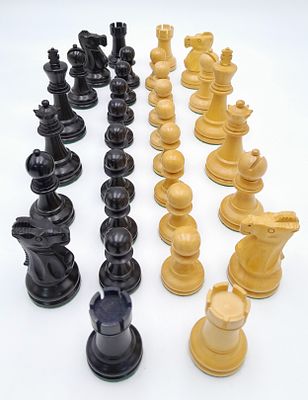 An Ebony and Boxwood Set of Chess Pieces. All having a felt bottom and of Indian origin. 3.25" King.