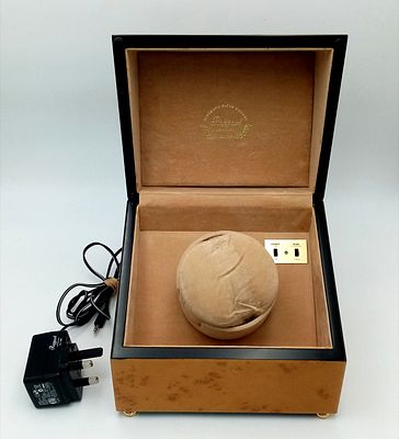 A Rapport of London Automatic Single Watch Winder. Comes with cable. Works but no guarantees. 