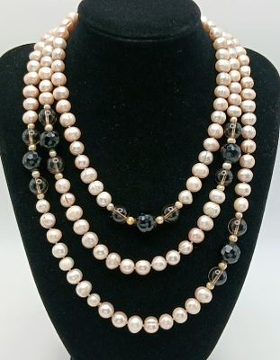 An attractive rope length Pink Freshwater Pearl Necklace with Black and Brown Bead Spacers. 