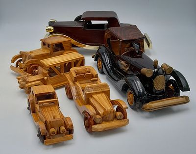 Six hand made wooden car models. Nice models.