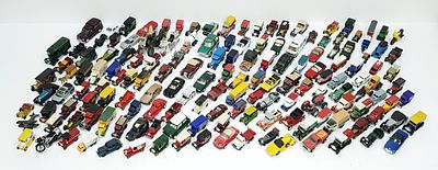 A box of loose die cast toy cars. Various makes and scales.