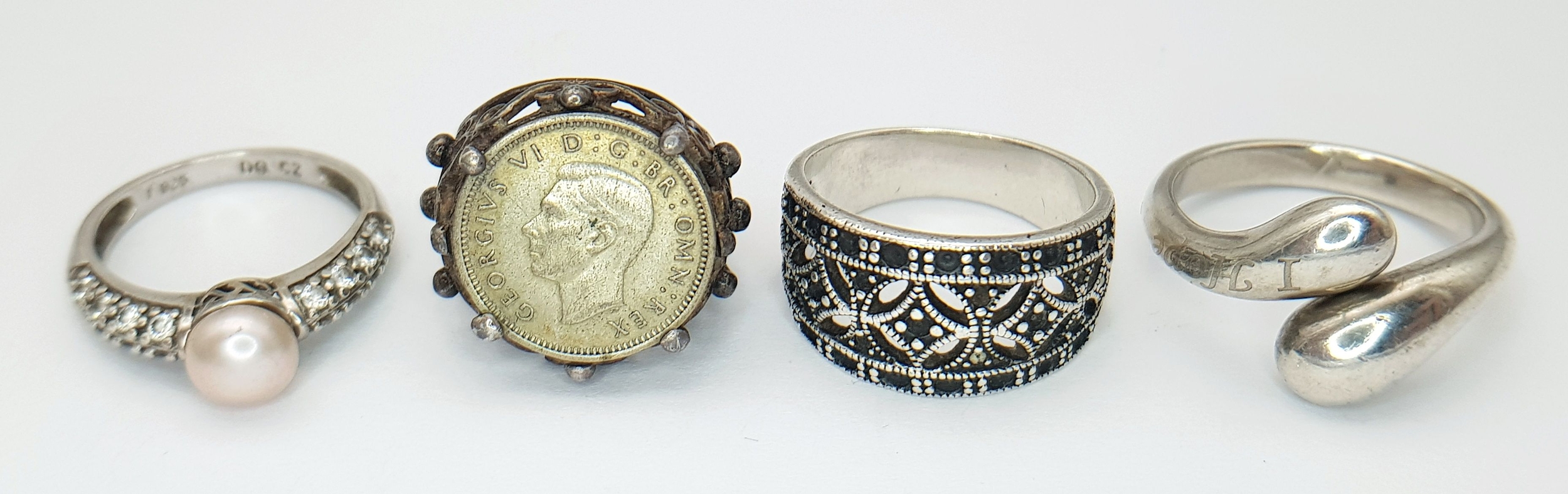 Four Different Style Silver Rings