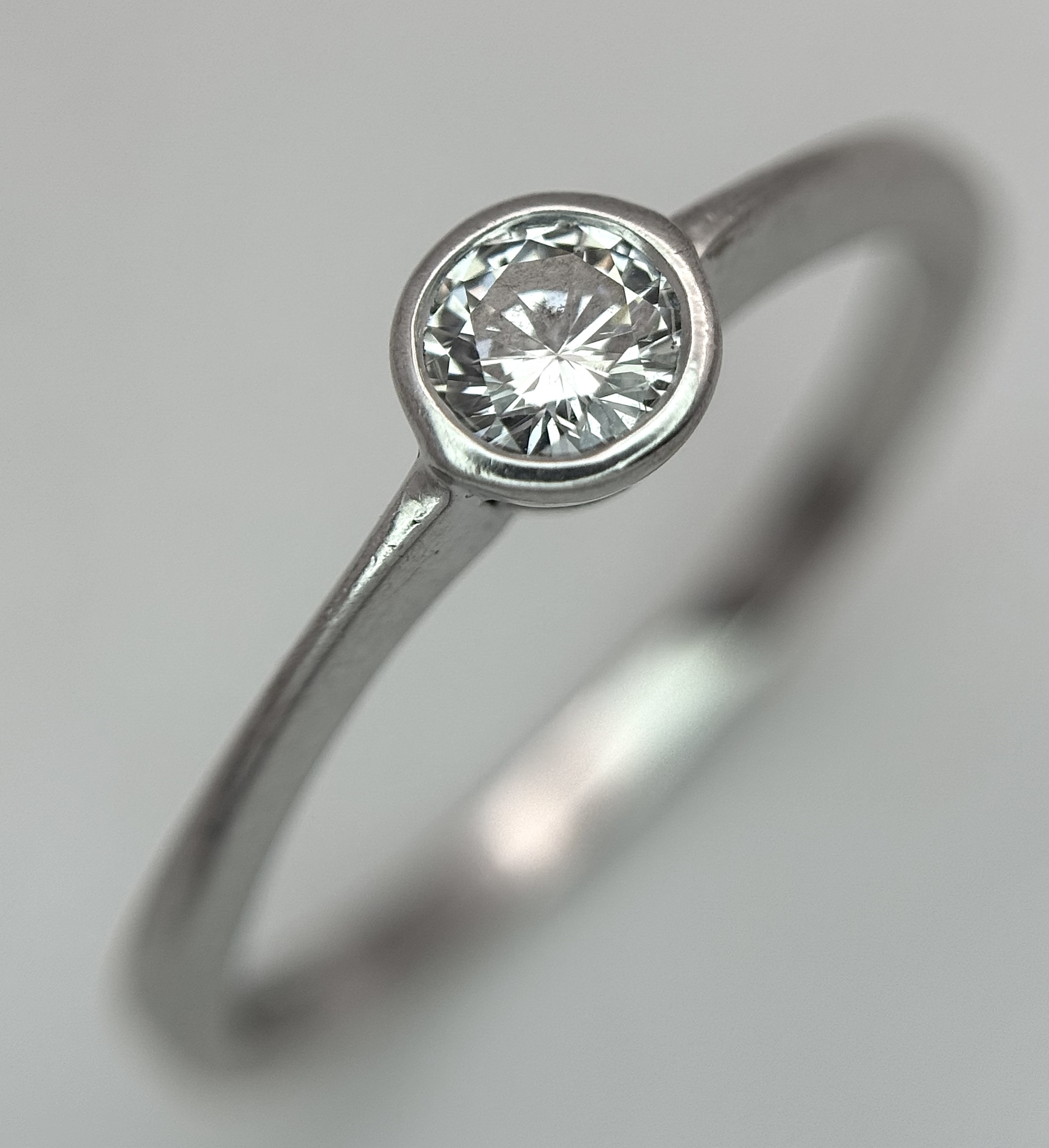 An 18K White Gold Diamond Solitaire Ring