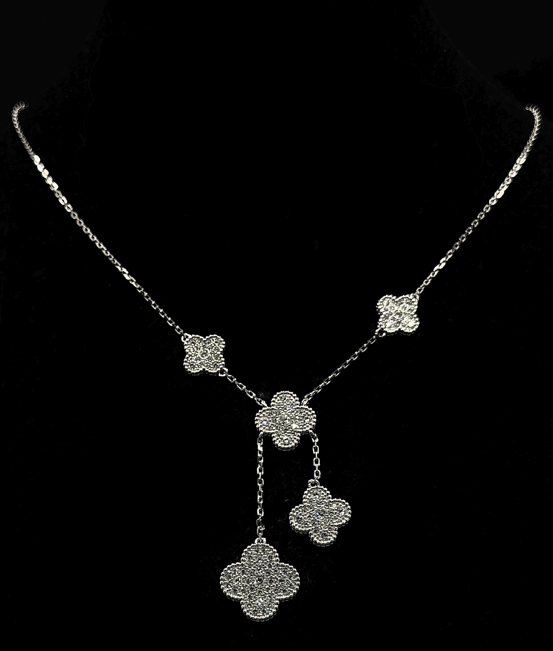 A stunning 925 silver stone set floral cluster drop pendant