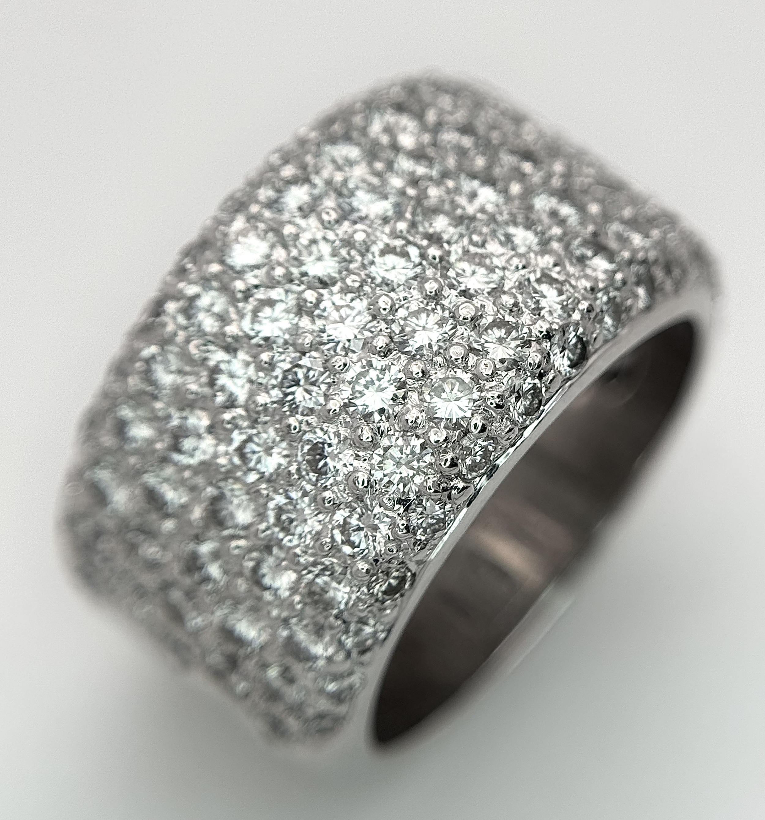 An 18K White Gold (tests as) Diamond Pave Dress Ring. c.1.4ctw of diamonds