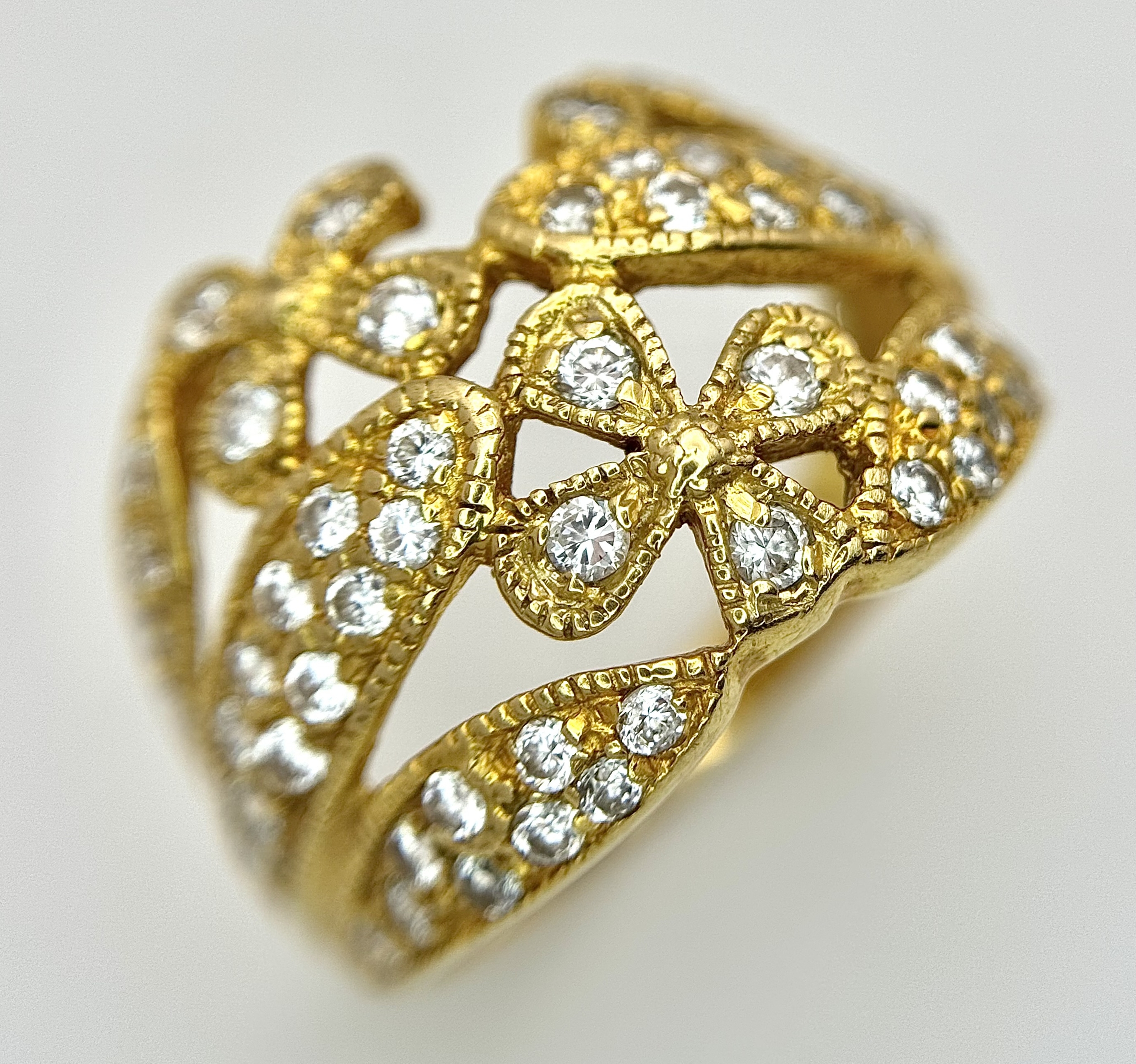An 18K Gold (tests as) and Diamond Ring