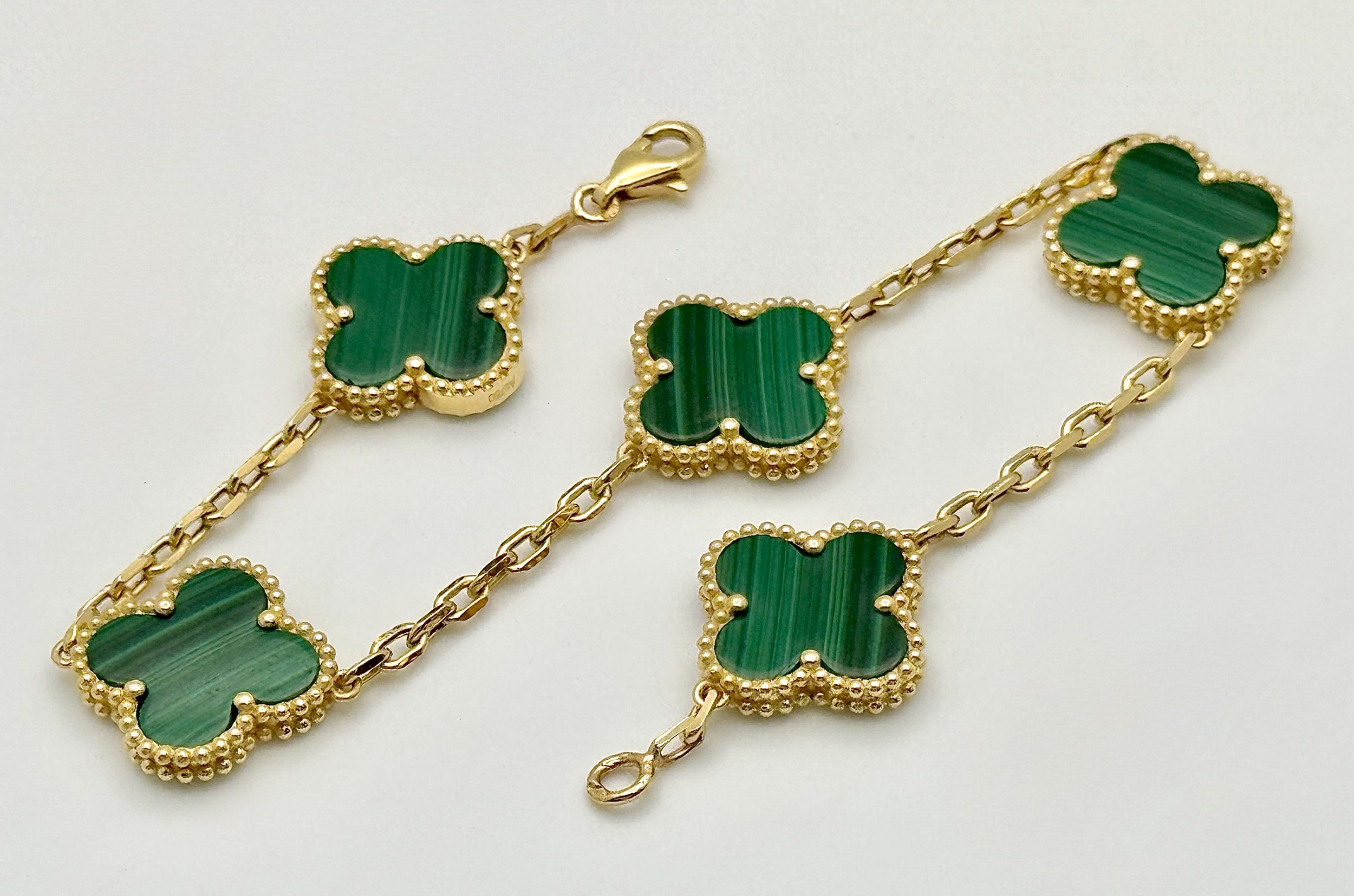 18k gold and malachite stone set five clover motifs bracelet