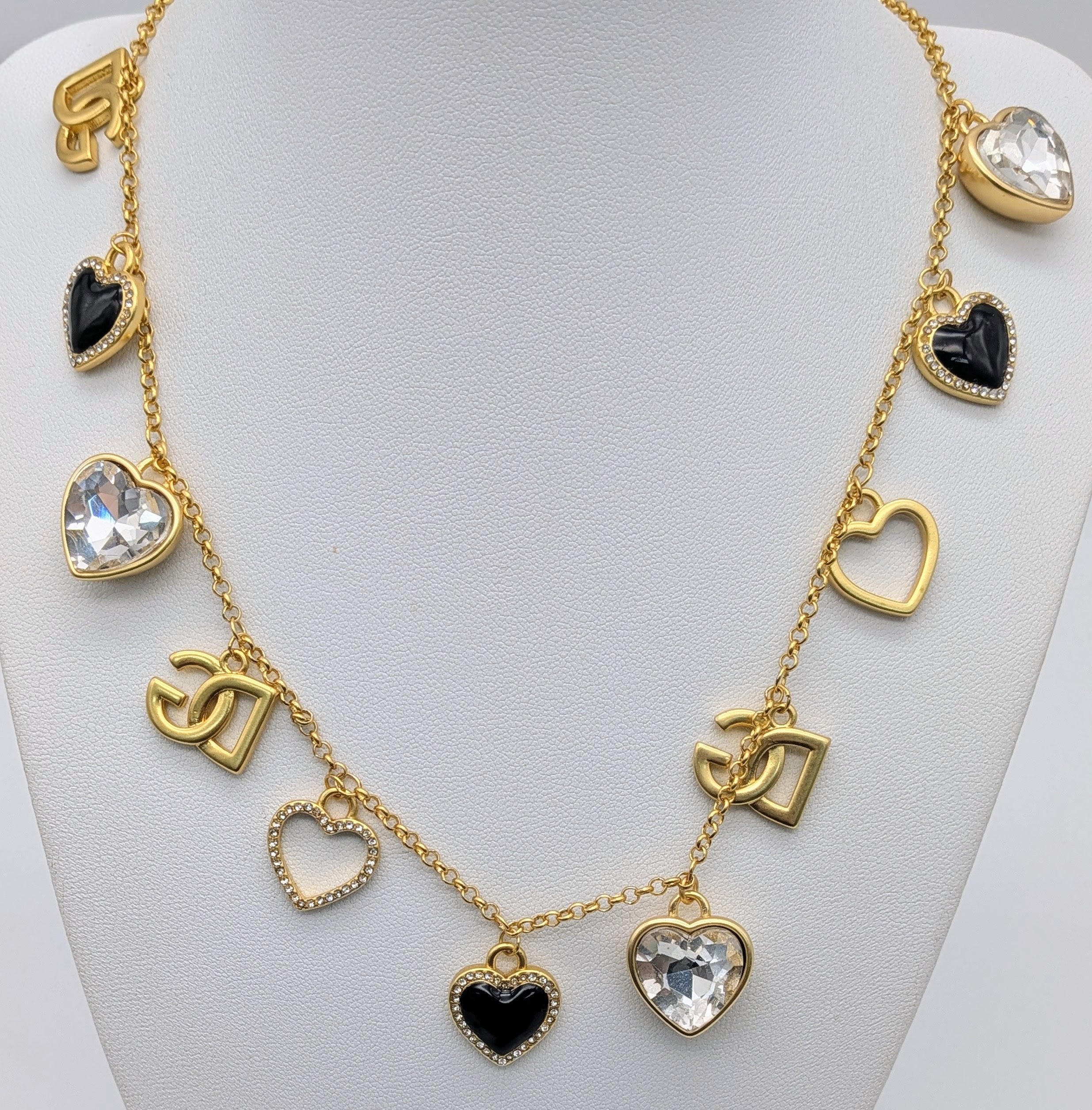A Dolce & Gabbana Logo and Hearts Necklace and Earrings Set
